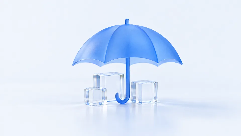 A blue glass umbrella sheltering three small glass blocks